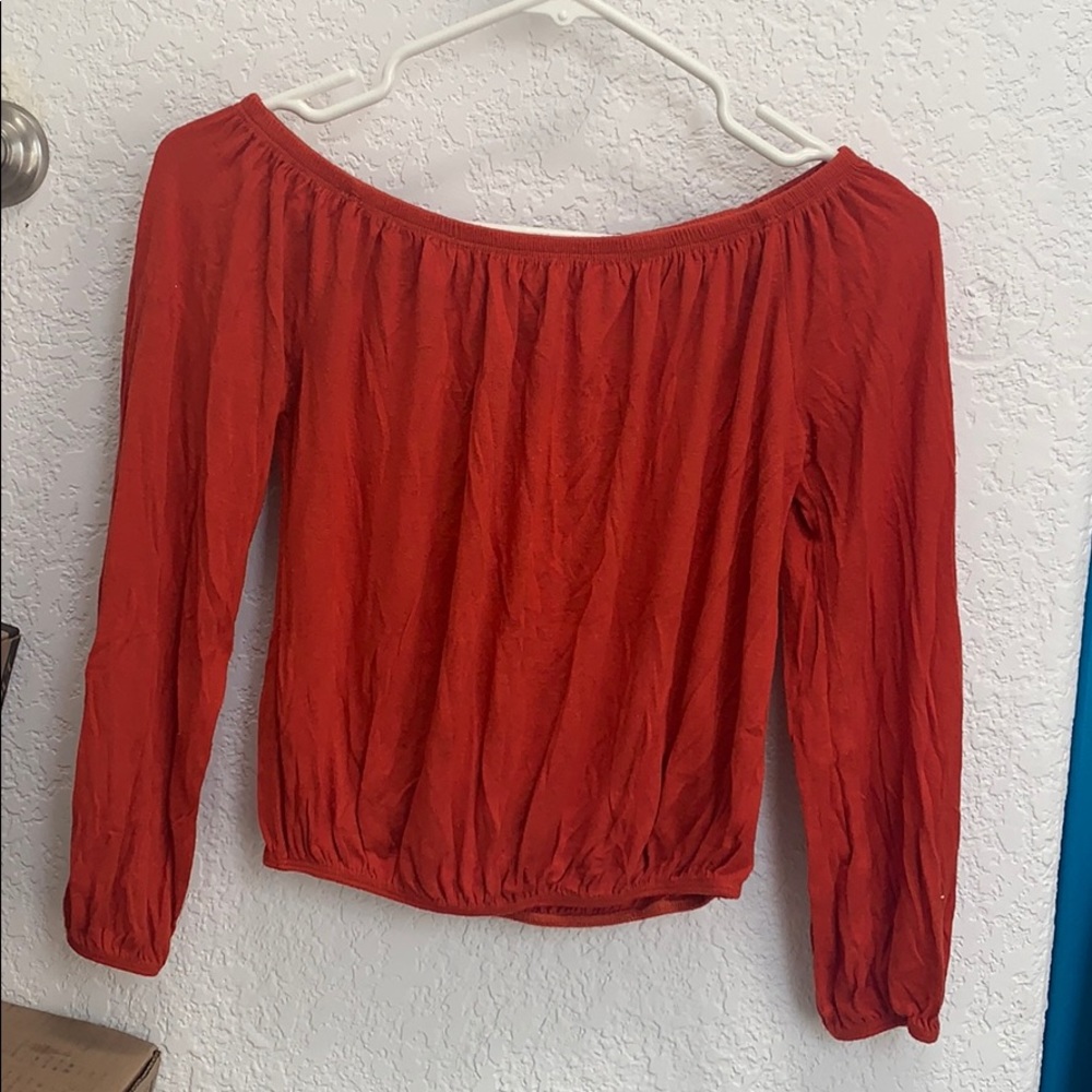 An orange burgundy long sleeve blouse